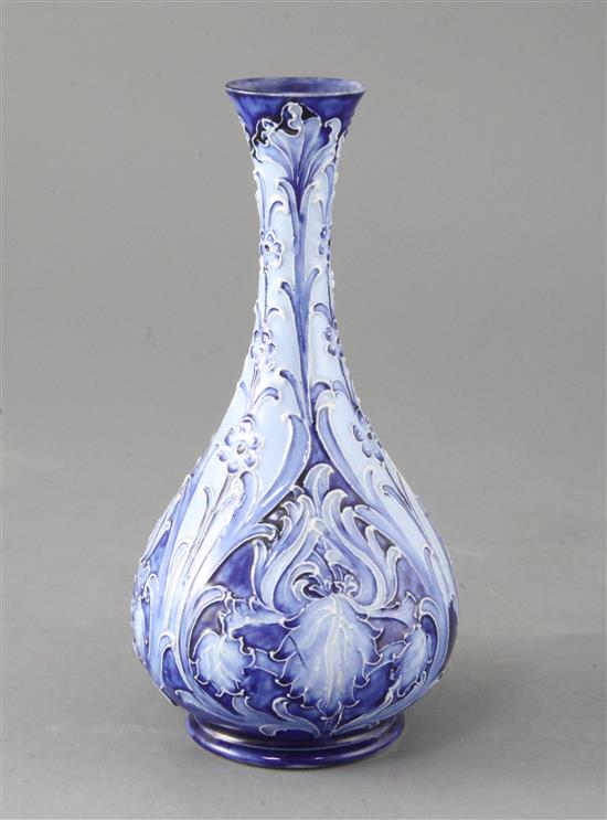 A Moorcroft Macintyre Florian ware bottle vase, in iris design, 20cm